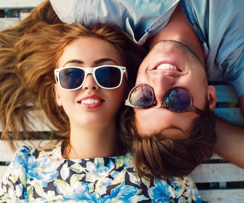 Man and woman wearing unique sunglasses