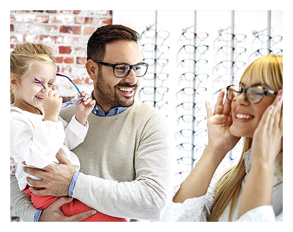 Happy family trying out eyewear collection at Dietz McLean Optical