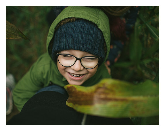 Kid wearing eyeglasses outdoor at Dietz McLean Optical