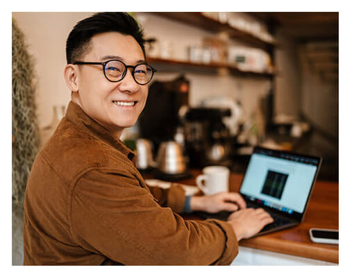 Man smiling wearing Dietz-McLean Optical specialty fit glasses